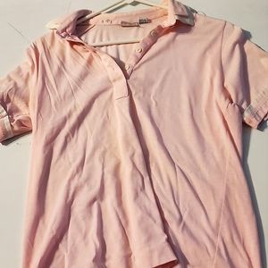 pink short sleeved Leon Levin medium polo shirt
